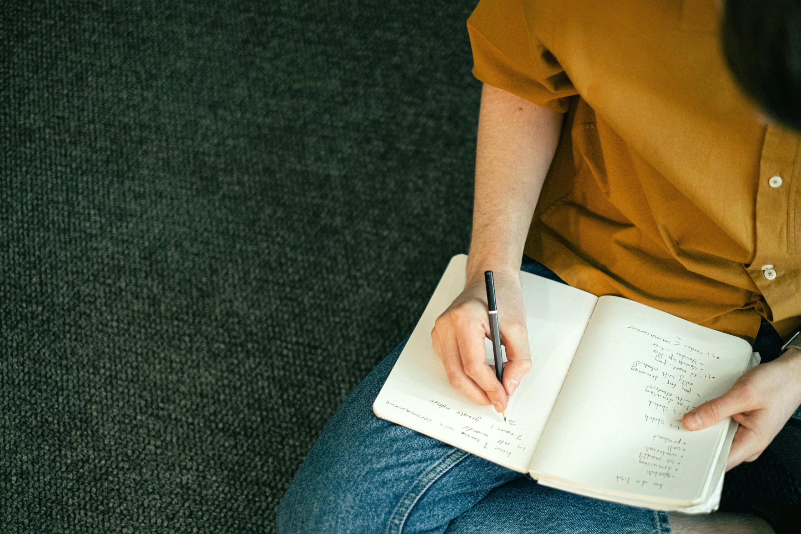 Hand holding notebook listing tips for successful tax planners