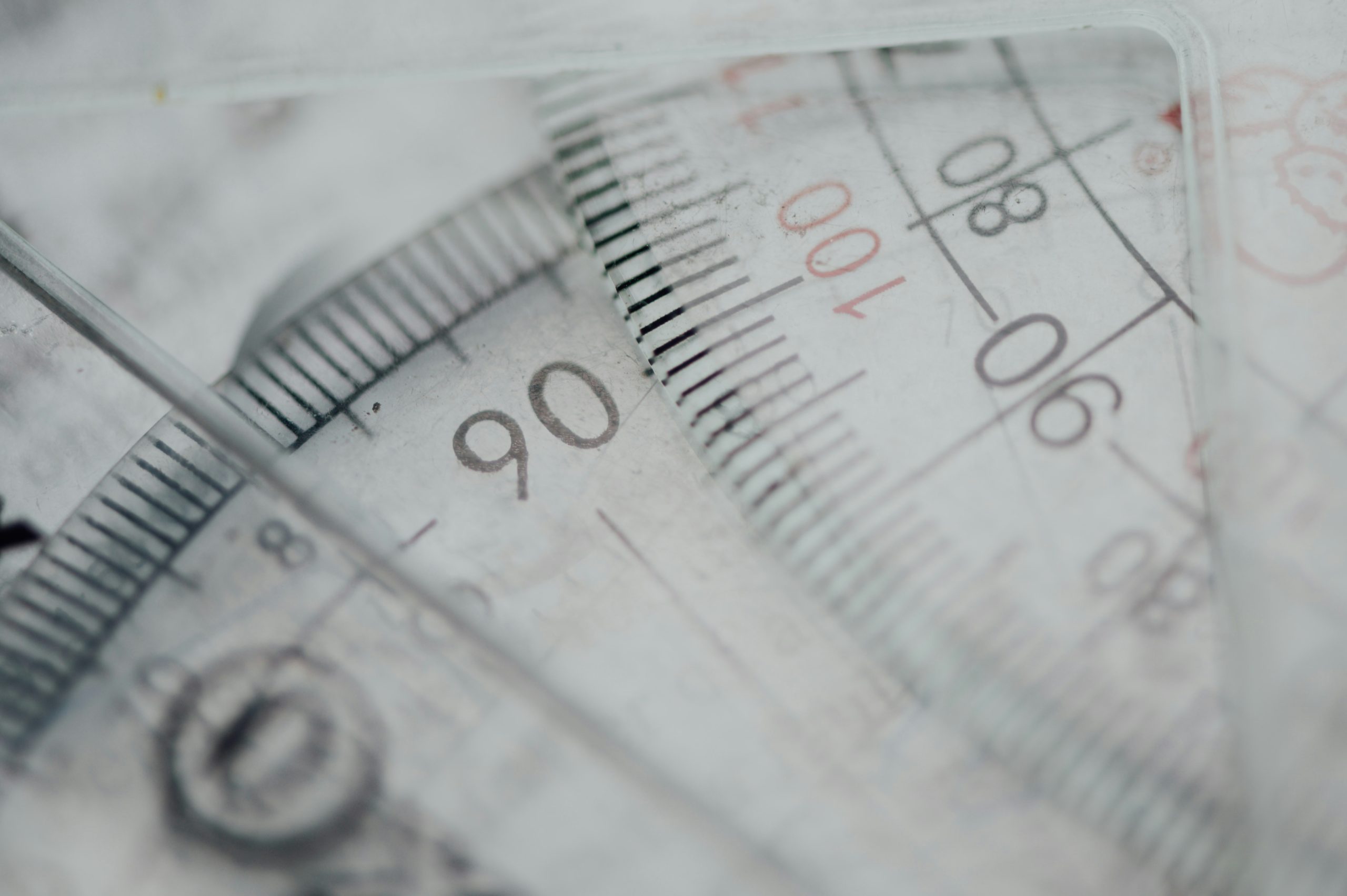 Illustration showing complexity of tax codes with a magnifying glass