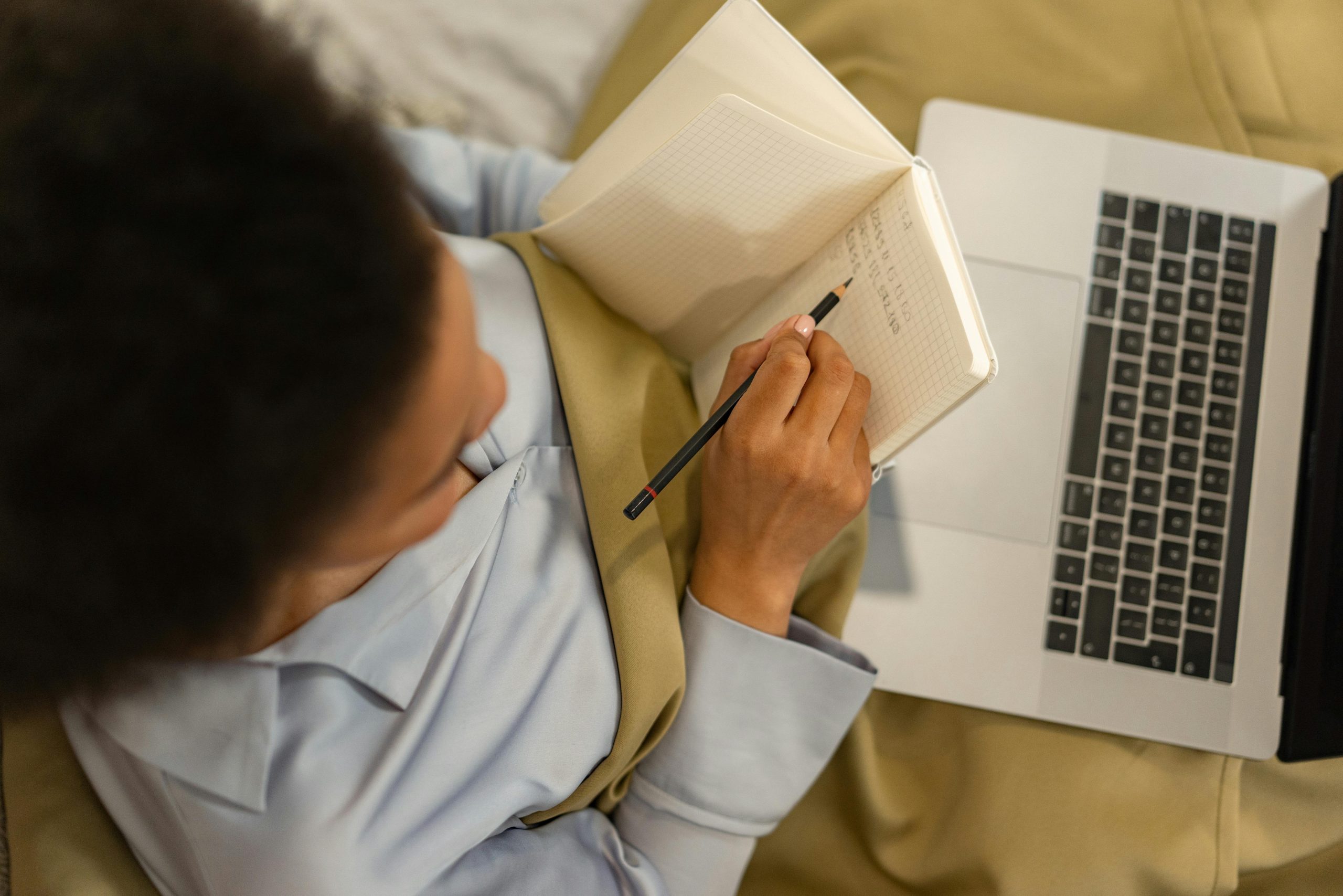 Person selecting an online course on laptop