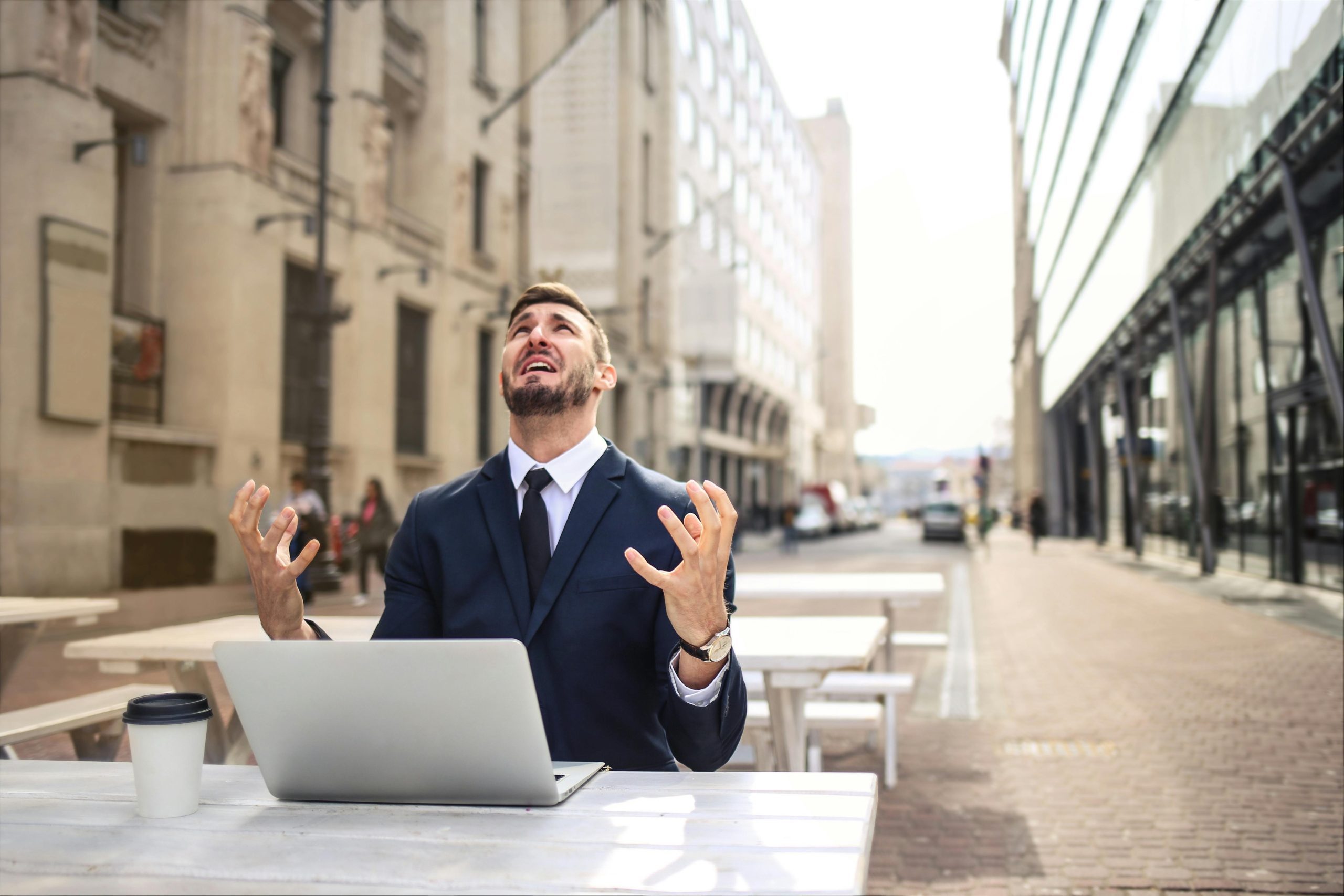 Stressed entrepreneur looking at complicated tax forms