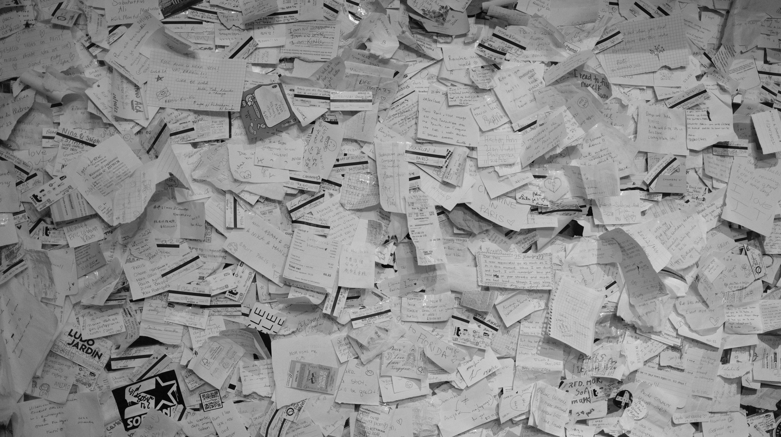 Taxpayer looking stressed while surrounded by piles of paperwork