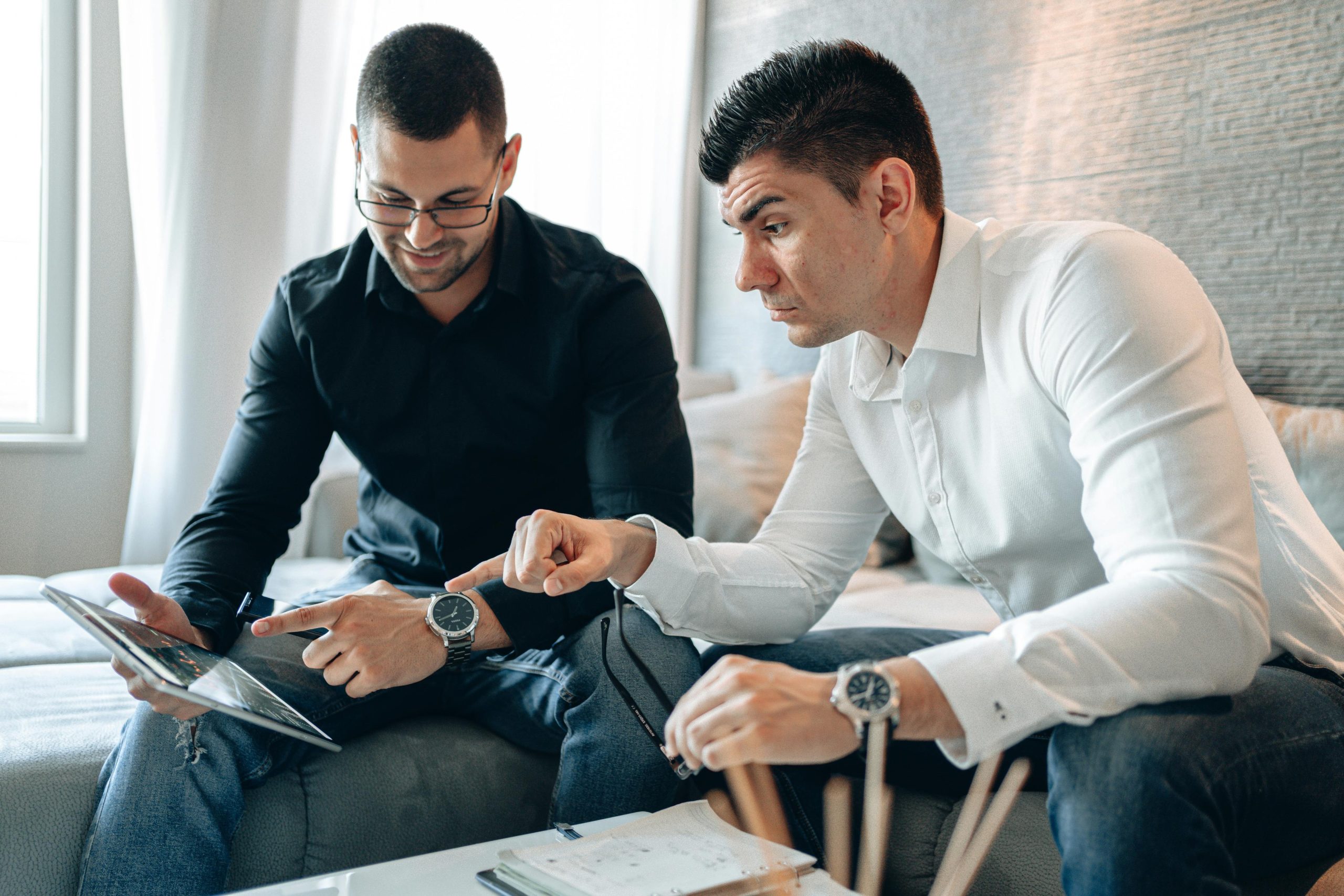 Two people discussing finances during a mentorship meeting