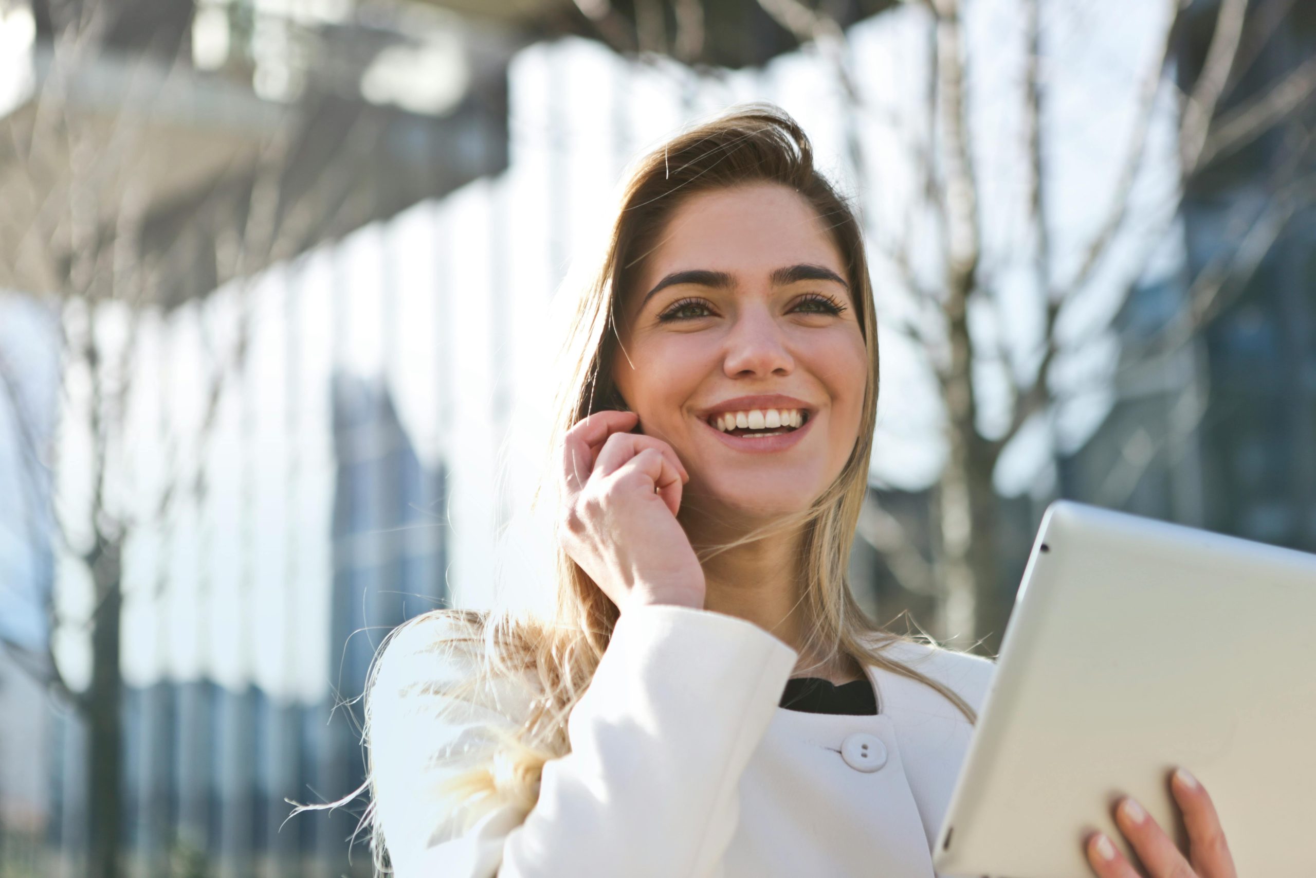 Young entrepreneur smiling while reviewing successful tax filings