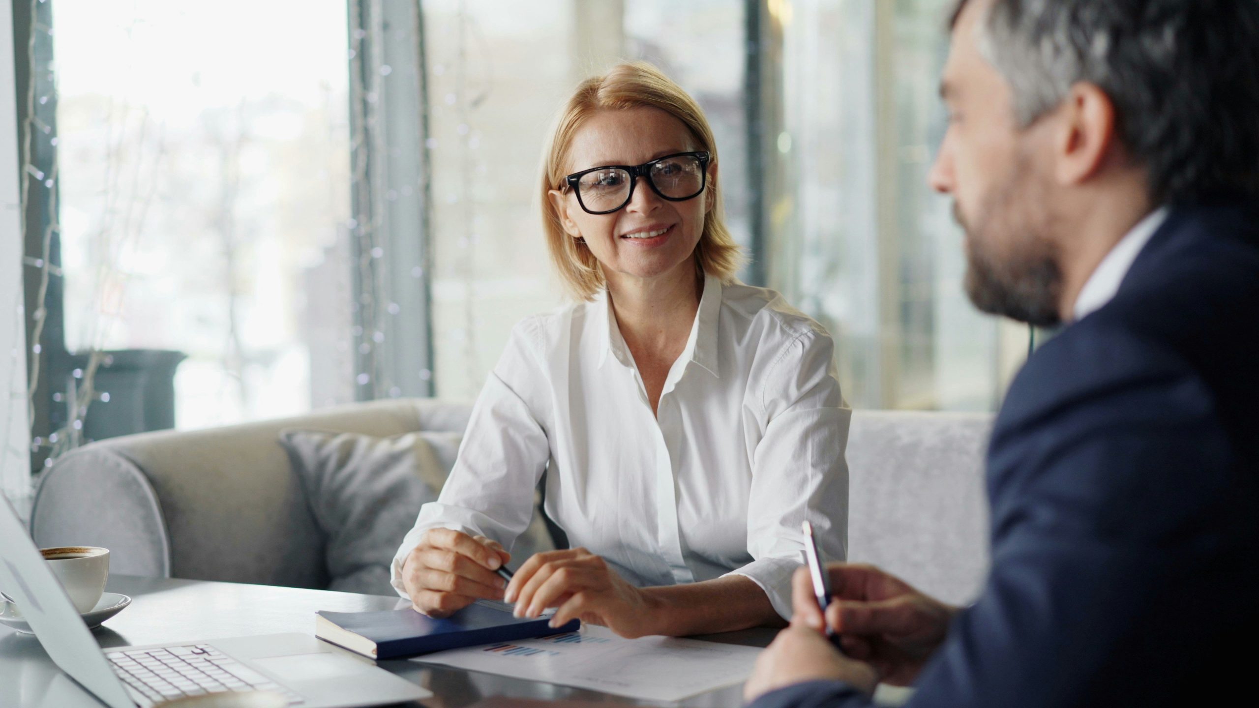Illustration showing overwhelmed person surrounded by tax documents