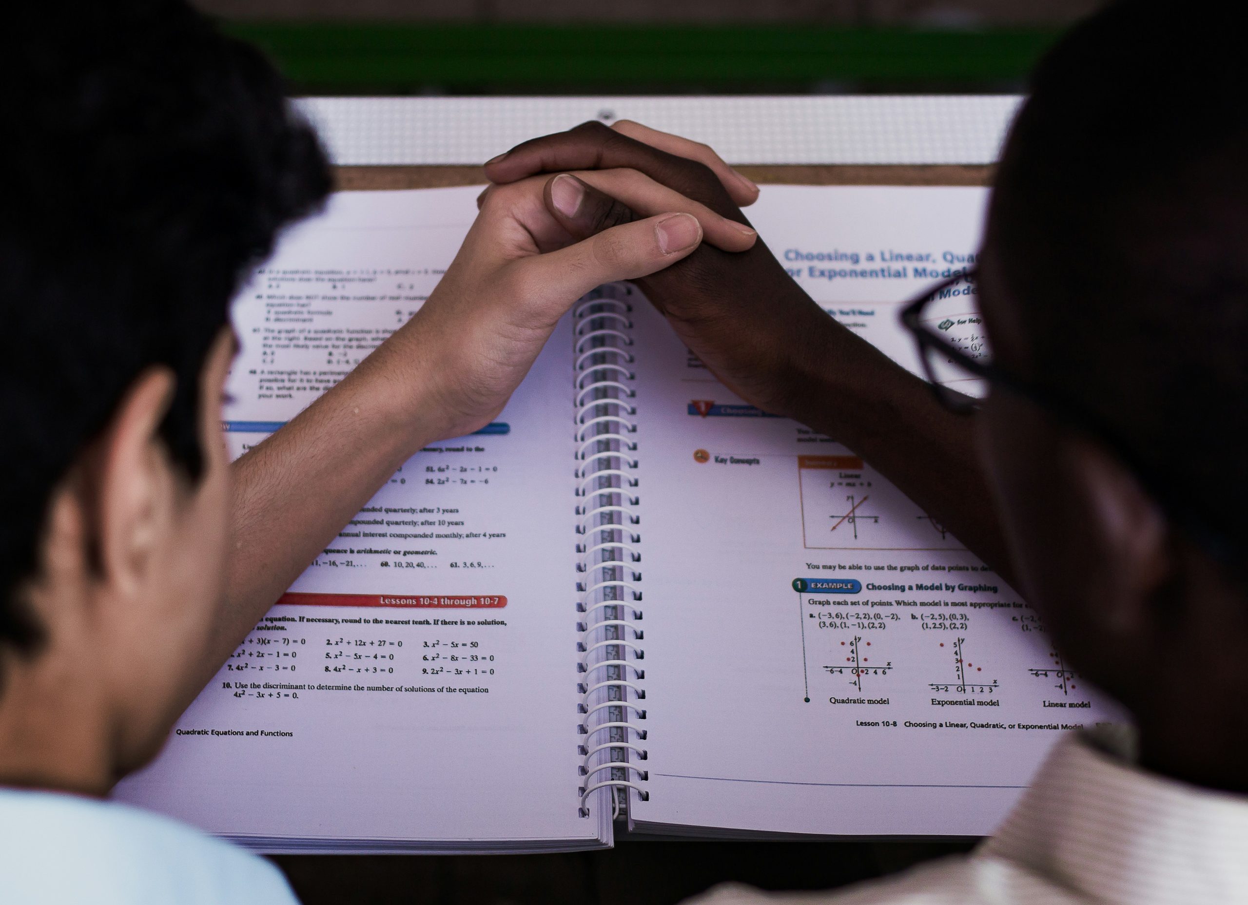 Photo of instructor teaching tax planning concepts using whiteboard.